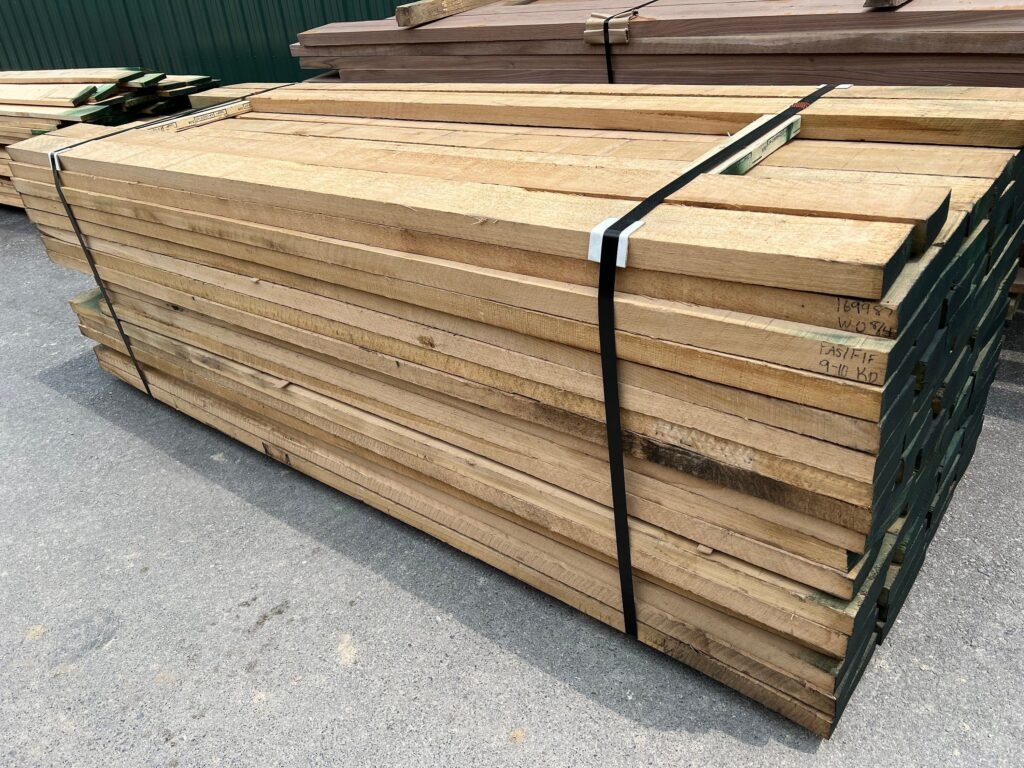 Lumber or timber bundle secured with steel strapping